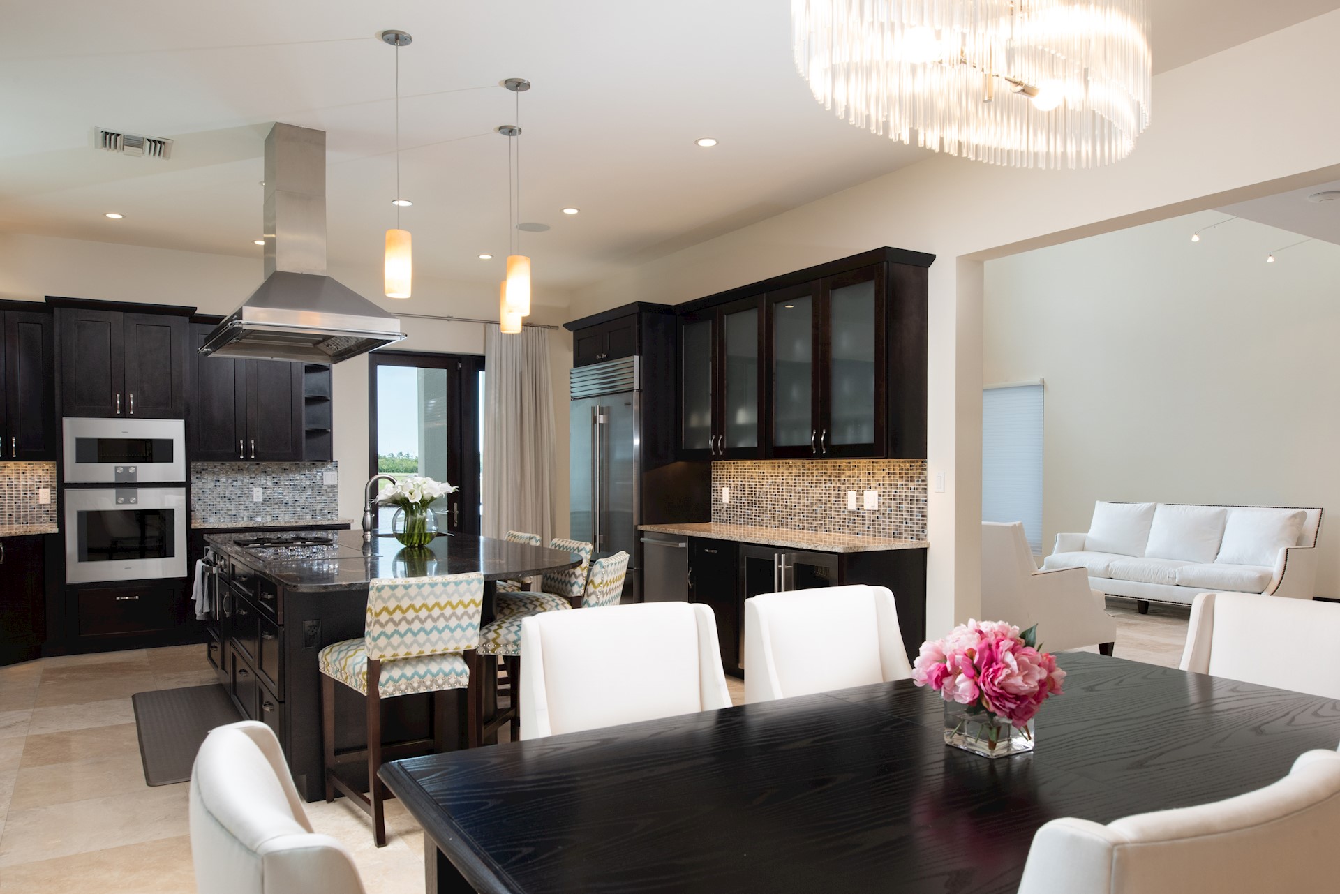 open plan kitchen space with pink flowers on table