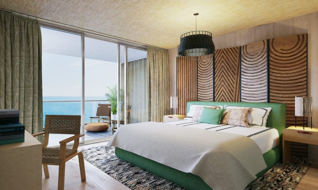 Bedroom with green interiors and wooden walls with an oceanfront view