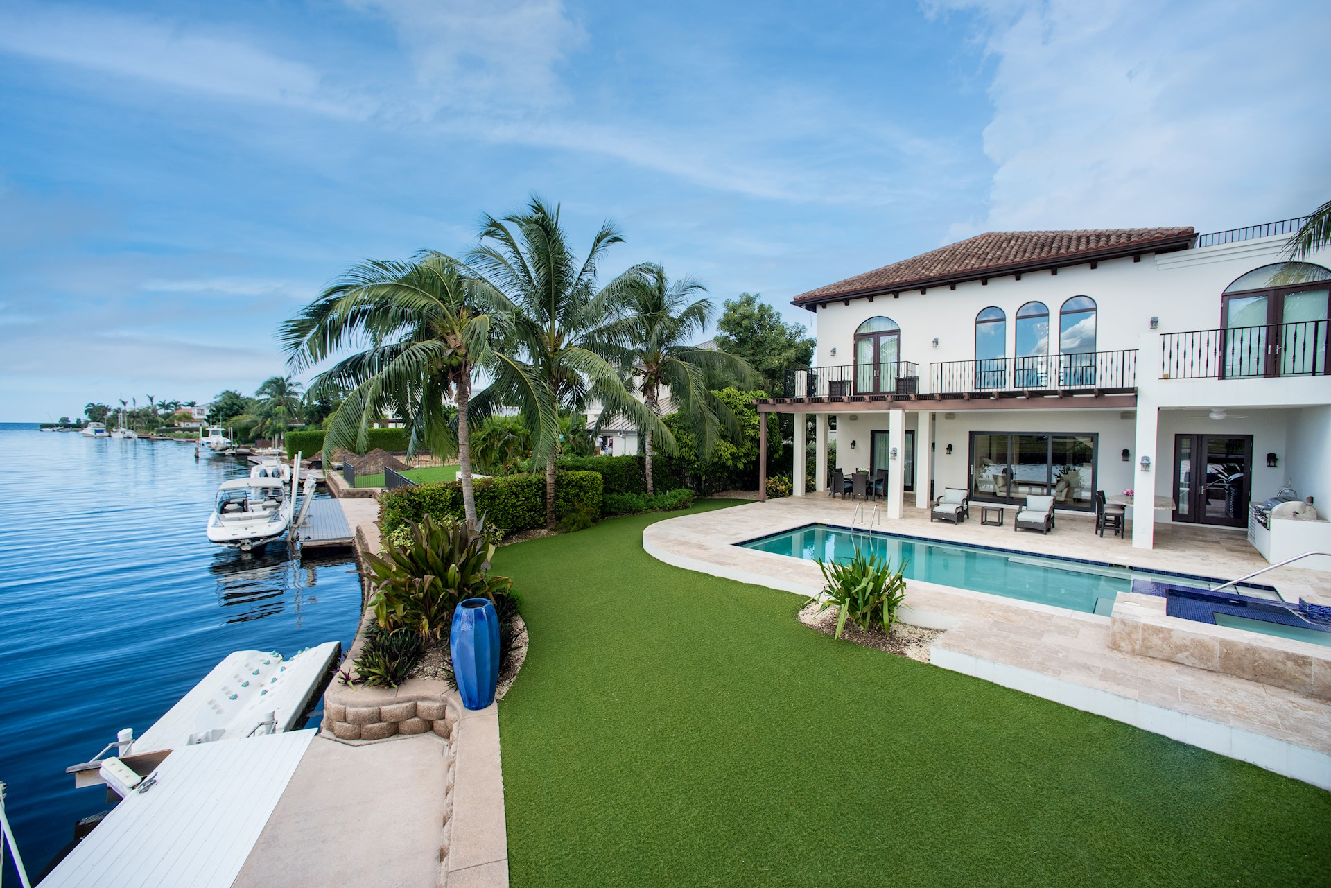 exterior of home on canal with pool