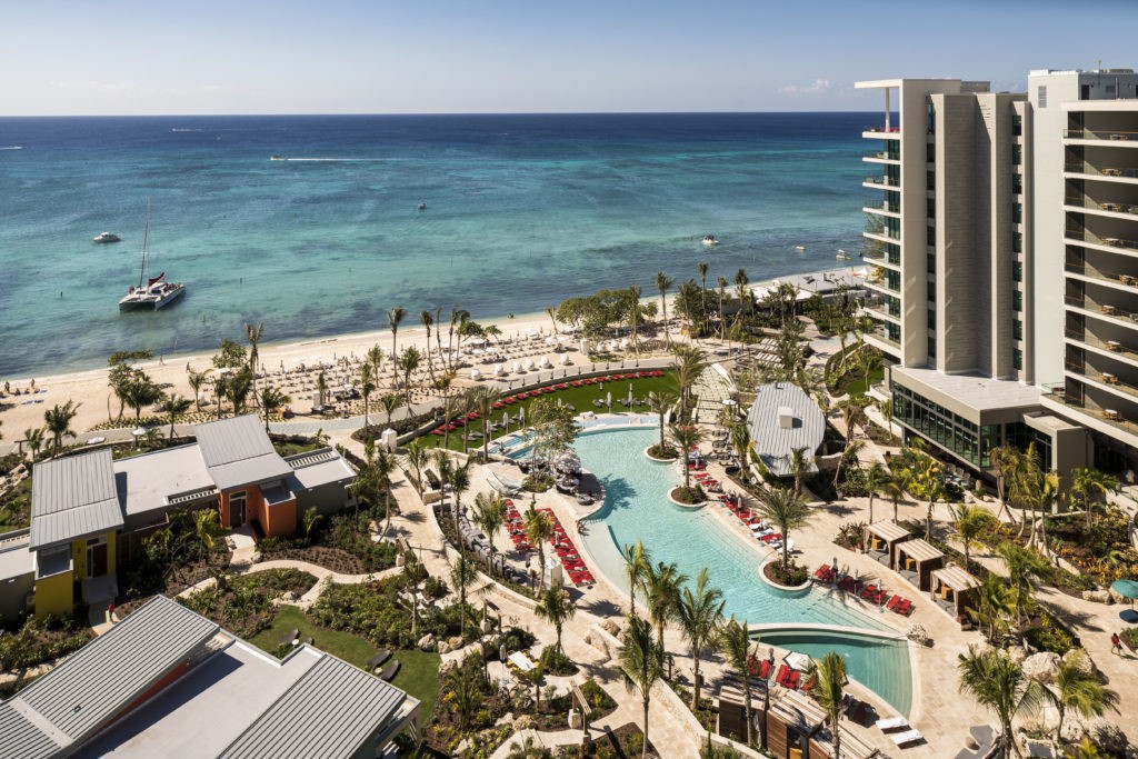 aerial view of hotel building, pool and Caribbean sea