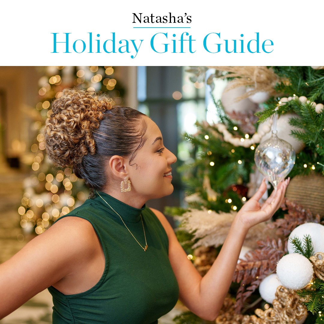 Woman of colour admiring Christmas ornament